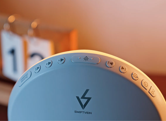 Round electronic device with control buttons and logo on a blurred background