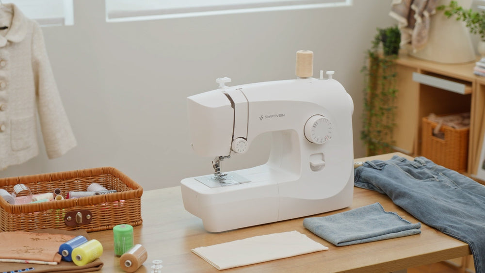 Swiftvein Stitch sewing machine on a wooden table with fabric and sewing supplies